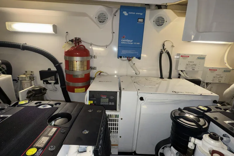 Slide: The Image of Engine room of 2007 Tiara Yachts 4300 Sovran with equipment and fire extinguisher. - 40