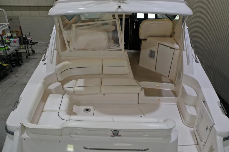 Slide: The Image of 2007 Tiara Yachts 4300 Sovran interior with white seating and helm station. - 6