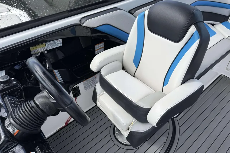 Slide: The Image of 2018 Yamaha Boats 242X E-Series interior with sleek seating and modern dashboard design. - 13