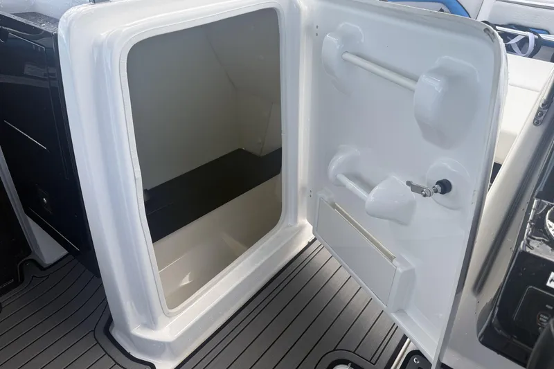 Slide: The Image of 2018 Yamaha Boats 242X E-Series interior with seating and table setup. - 19