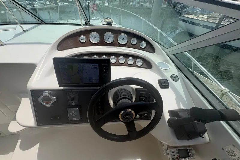 Slide: The Image of Cockpit of 2000 Monterey 322 Cruiser with steering wheel and navigation instruments. - 16