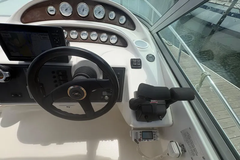 Slide: The Image of Helm of 2000 Monterey 322 Cruiser with steering wheel and navigation instruments. - 18