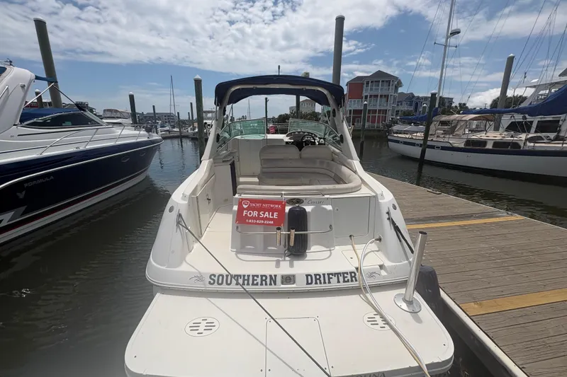 Slide: The Image of 2000 Monterey 322 Cruiser boat docked, "Southern Drifter," for sale sign visible. - 2