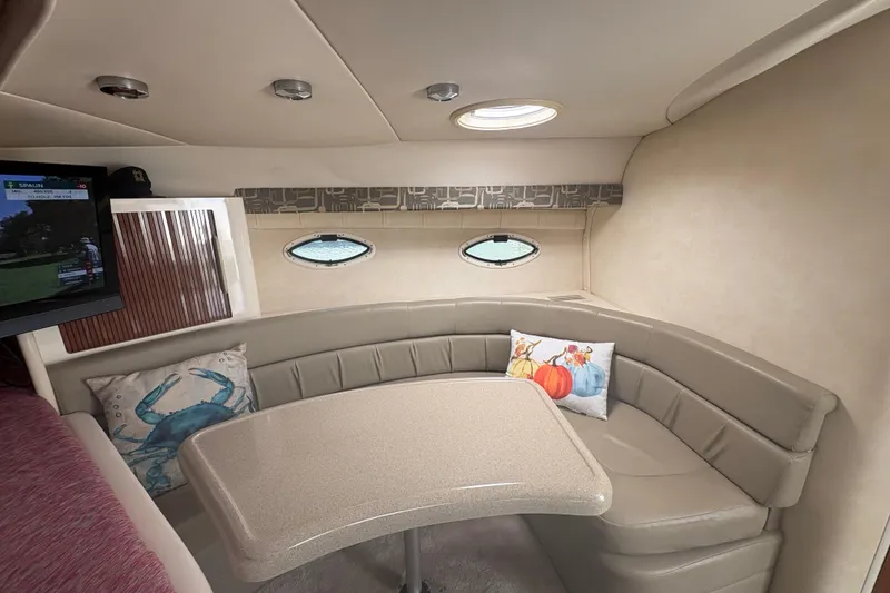 Slide: The Image of Interior of 2000 Monterey 322 Cruiser with cozy seating and decorative pillows. - 30
