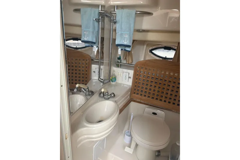 Slide: The Image of Bathroom interior of 2000 Monterey 322 Cruiser with sink, toilet, and mirror. - 44