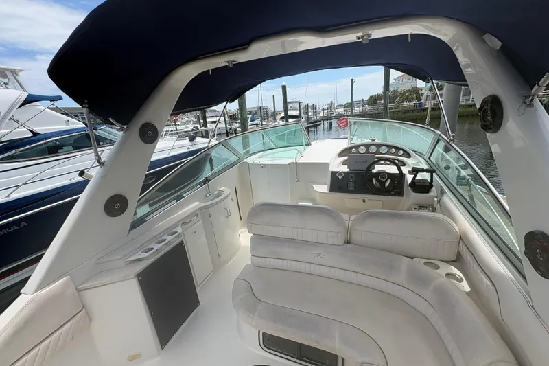 Slide: The Image of Interior view of a 2000 Monterey 322 Cruiser boat docked at a marina. - 8