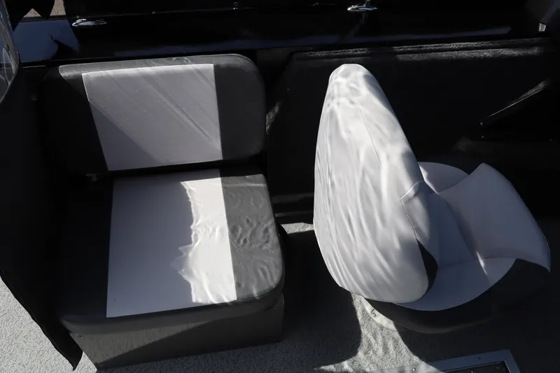 Slide: The Image of Interior seating of 2026 Smoker Craft Osprey 172 boat, featuring cushioned seats. - 12