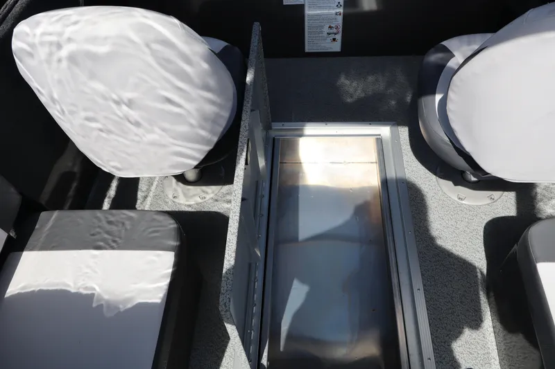 Slide: The Image of Interior of 2026 Smoker Craft Osprey 172 boat with seating and storage compartment. - 13