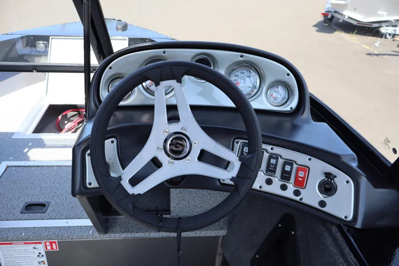 Slide: The Image of Steering console of 2026 Smoker Craft Osprey 172 boat with gauges and controls. - 14