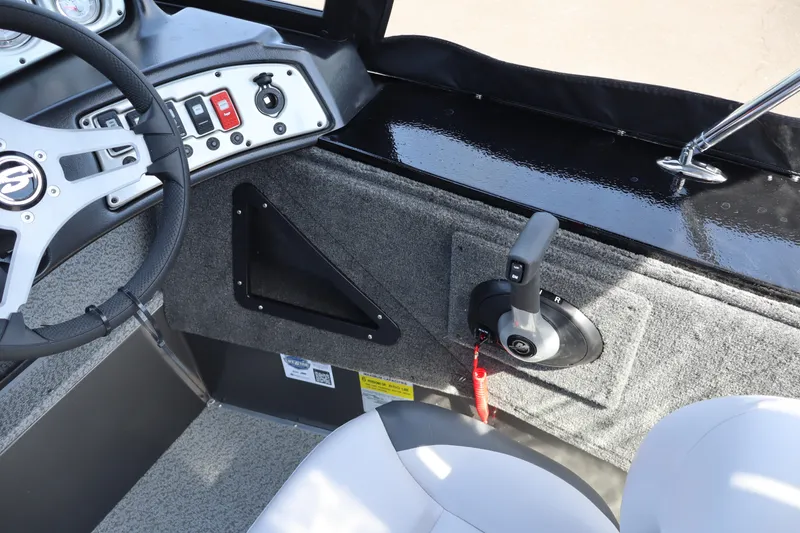 Slide: The Image of 2026 Smoker Craft Osprey 172 boat interior with steering wheel and control panel. - 15