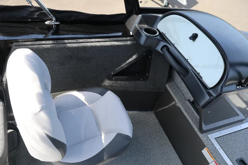 Slide: The Image of 2026 Smoker Craft Osprey 172 boat interior with seating and dashboard view. - 16
