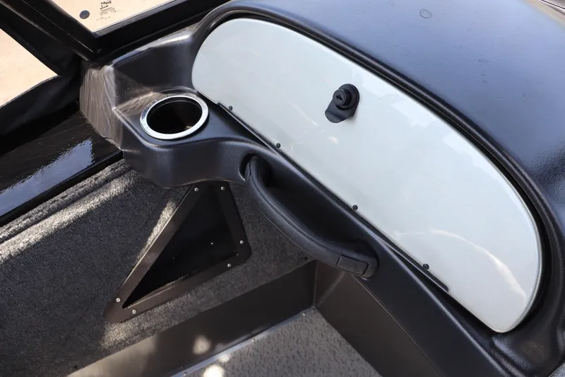 Slide: The Image of 2026 Smoker Craft Osprey 172 boat interior with cup holder and storage compartment. - 17