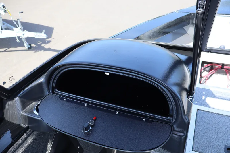 Slide: The Image of 2026 Smoker Craft Osprey 172 boat dashboard with open glove compartment. - 18