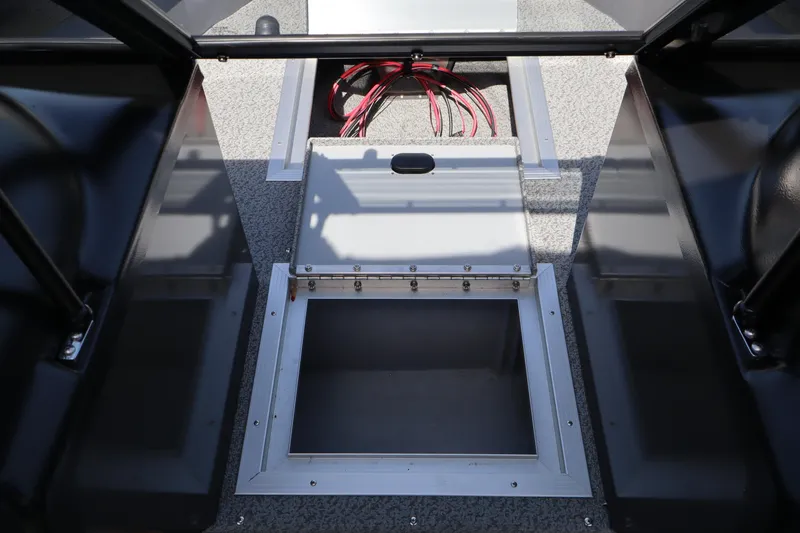 Slide: The Image of 2026 Smoker Craft Osprey 172 boat interior with open storage compartment. - 19