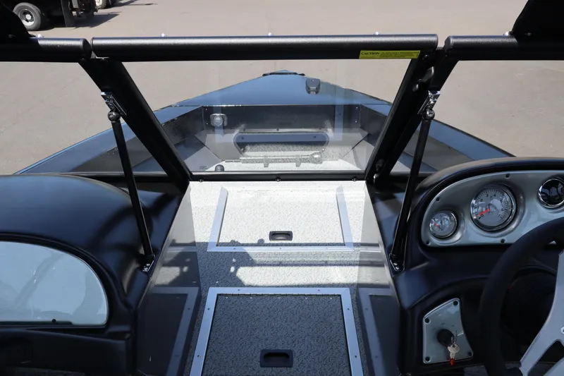 Slide: The Image of 2026 Smoker Craft Osprey 172 boat dashboard with gauges and windshield. - 23