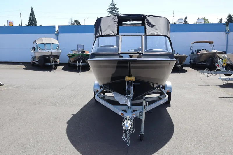 Slide: The Image of 2026 Smoker Craft Osprey 172 boat on trailer, parked outdoors. - 3