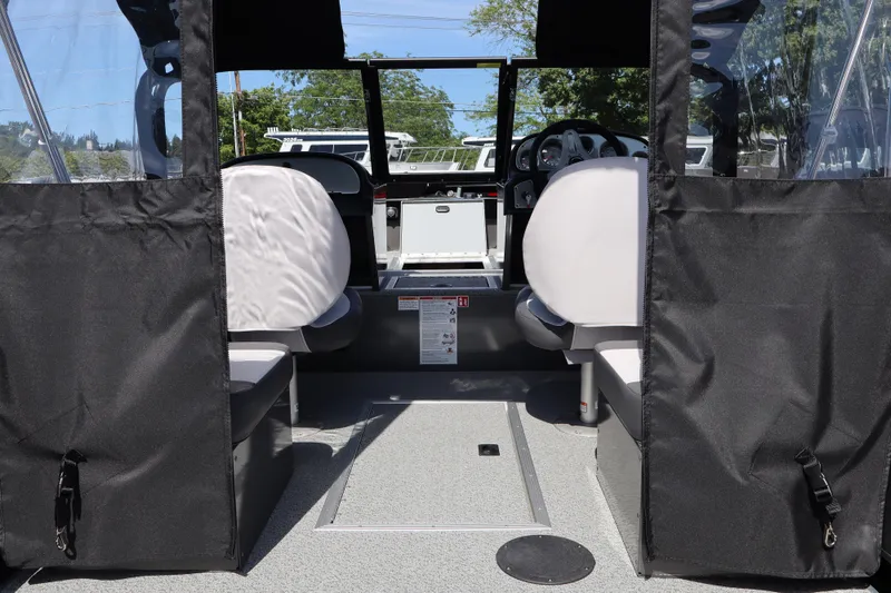 Slide: The Image of Interior view of 2026 Smoker Craft Osprey 172 boat with seating and dashboard. - 7