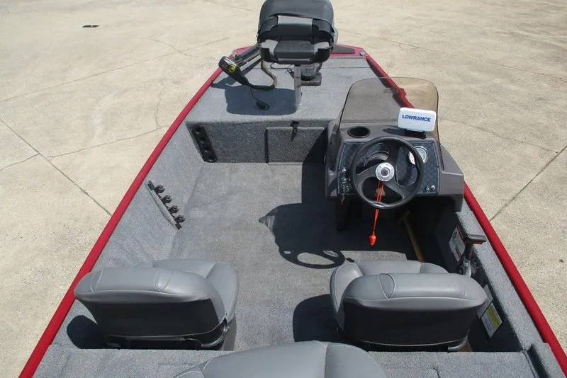Slide: The Image of 2022 Tracker Bass Tracker Classic XL boat interior with steering console and seating. - 7