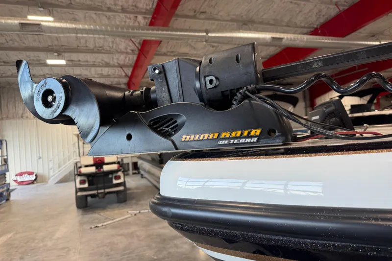 Slide: The Image of Minn Kota Ulterra motor on 2014 Nitro ZV21 boat in a garage setting. - 11