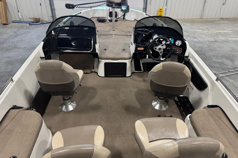 Slide: The Image of Interior of a 2014 Nitro ZV21 boat with seating and steering console. - 6