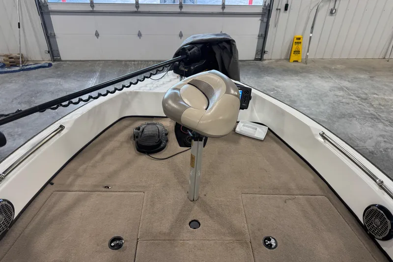 Slide: The Image of Interior of a 2014 Nitro ZV21 boat with a swivel seat and fishing equipment. - 8