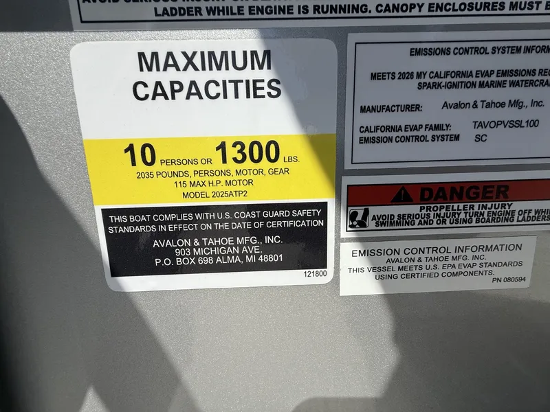 Slide: The Image of Boat label showing capacity and safety information, 2026 Avalon Venture model. - 12