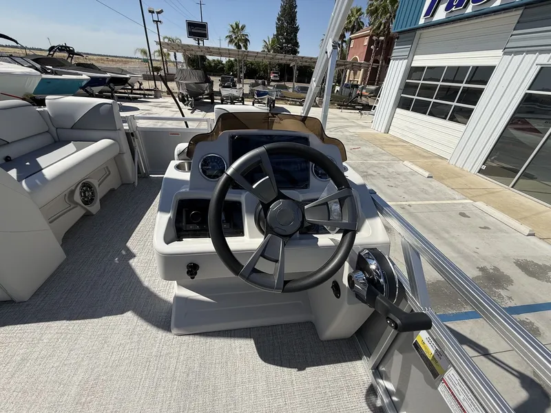 Slide: The Image of 2026 Avalon Venture Versatile helm with 60HP Mercury engine. - 13