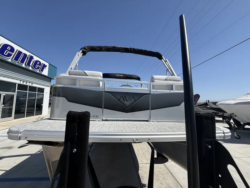 Slide: The Image of 2026 Avalon Venture Versatile boat with 60HP Mercury engine. - 4