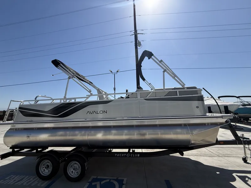 Slide: The Image of Avalon Venture Versatile 2026 pontoon boat with 60HP Mercury engine. - 6
