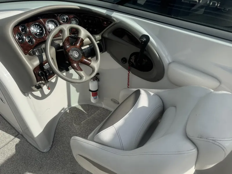 Slide: The Image of Interior of 2008 Crownline Bowrider 270 BR with steering console. - 13