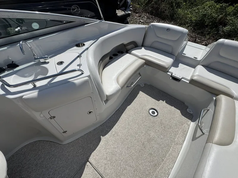 Slide: The Image of Interior of 2008 Crownline Bowrider 270 BR with seating and sink area. - 4