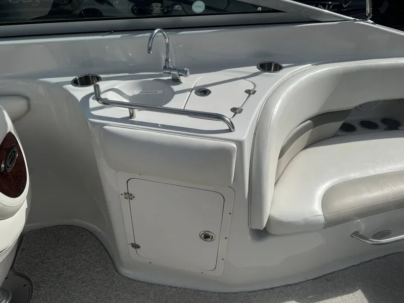Slide: The Image of Interior of 2008 Crownline Bowrider 270 BR with sink and seating area. - 8