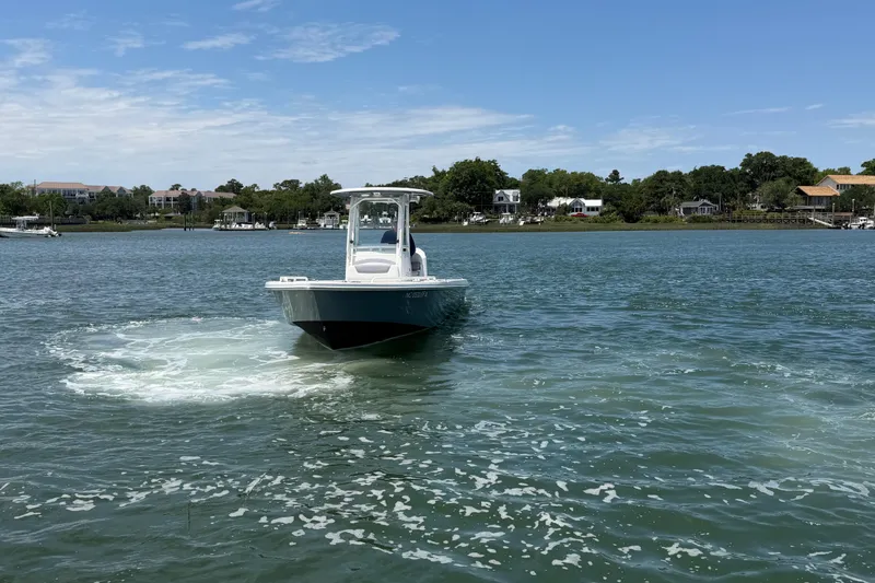 Slide: The Image of 2017 Everglades 243 Center Console boat cruising on a scenic waterway. - 18