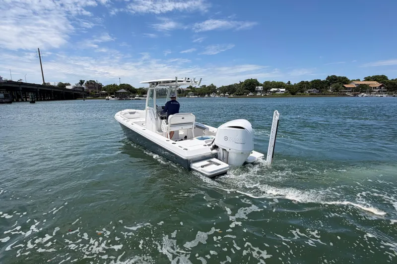 Slide: The Image of 2017 Everglades 243 Center Console boat cruising on a sunny day. - 20