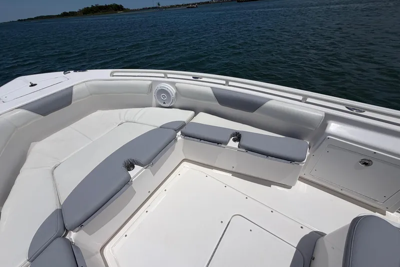 Slide: The Image of 2017 Everglades 243 Center Console boat interior with cushioned seating and ocean view. - 26
