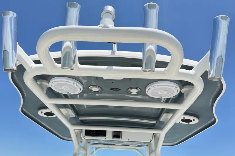 Slide: The Image of T-top view of 2017 Everglades 243 Center Console boat with rod holders and speakers. - 38