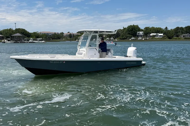 Slide: The Image of 2017 Everglades 243 Center Console boat on water, with scenic background. - 7
