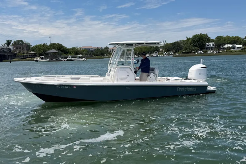 Slide: The Image of 2017 Everglades 243 Center Console boat cruising on a sunny day. - 8