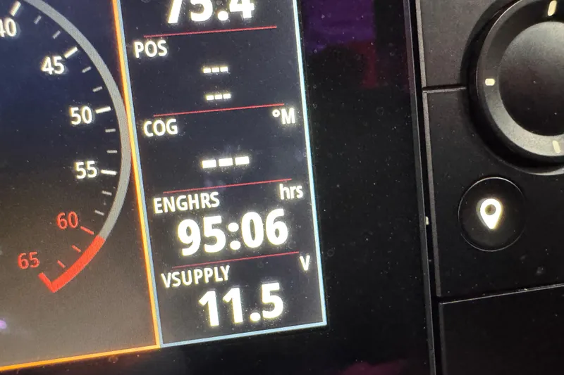 Slide: The Image of Dashboard display of 2023 Chaparral 307 SSX showing engine hours and voltage. - 16