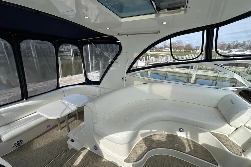 Slide: The Image of Luxurious interior of 2005 Cruisers Yachts 440 Express with elegant seating and panoramic windows. - 24