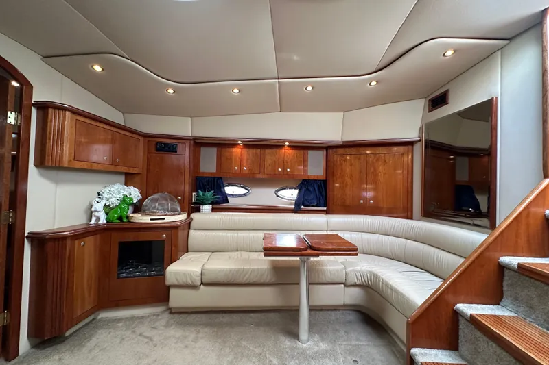Slide: The Image of Luxurious interior of 2005 Cruisers Yachts 440 Express with elegant wood and leather furnishings. - 26
