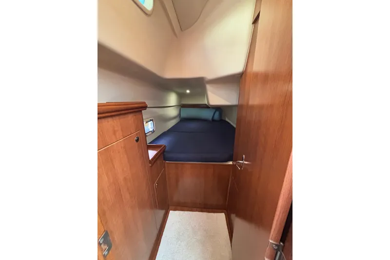 Slide: The Image of Cozy cabin interior of 2014 Gemini Legacy 35 sailboat with wooden finish. - 18