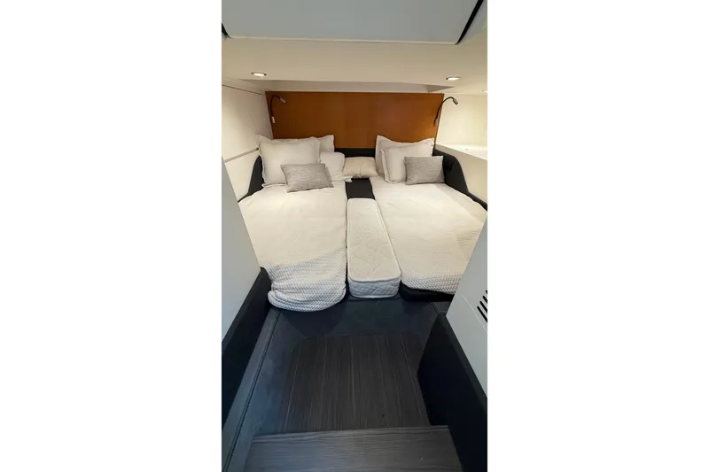 Slide: The Image of 2024 Azimut Verve 48 cabin interior with twin beds and modern decor. - 13