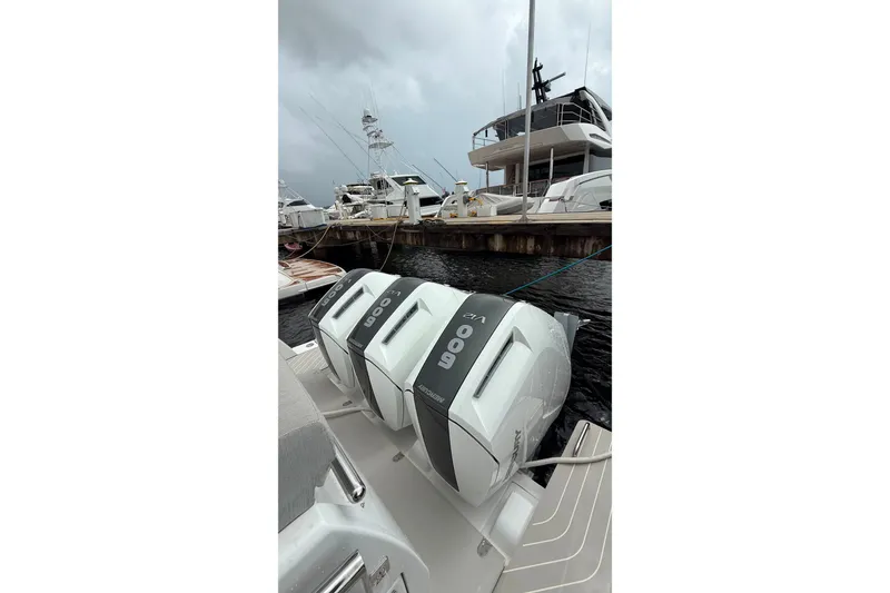 Slide: The Image of 2024 Azimut Verve 48 yacht with triple 600 horsepower outboard engines docked at marina. - 19