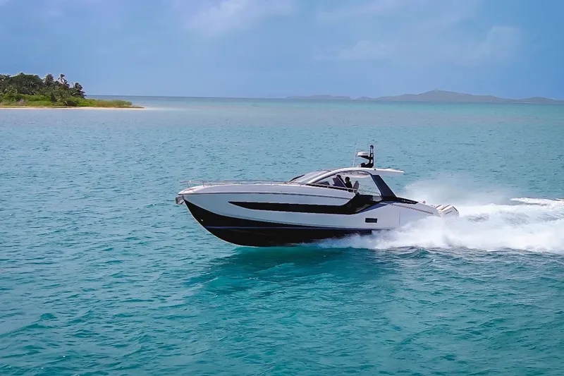 Slide: The Image of 2024 Azimut Verve 48 yacht cruising on turquoise ocean near tropical island. - 24