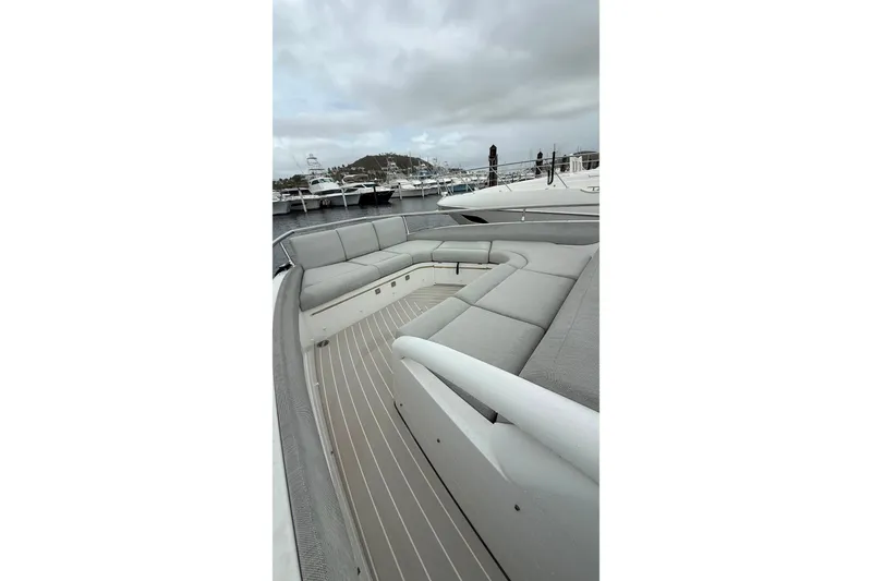 Slide: The Image of Luxurious 2024 Azimut Verve 48 yacht with spacious deck seating at marina. - 14