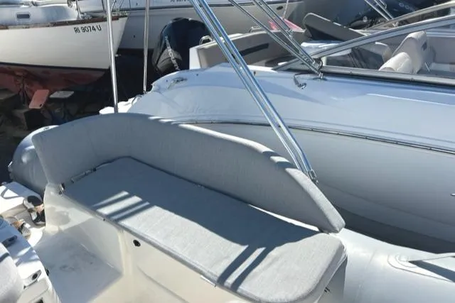 Slide: The Image of 2023 Zodiac N-ZO 680 boat with cushioned seating and sleek design. - 16