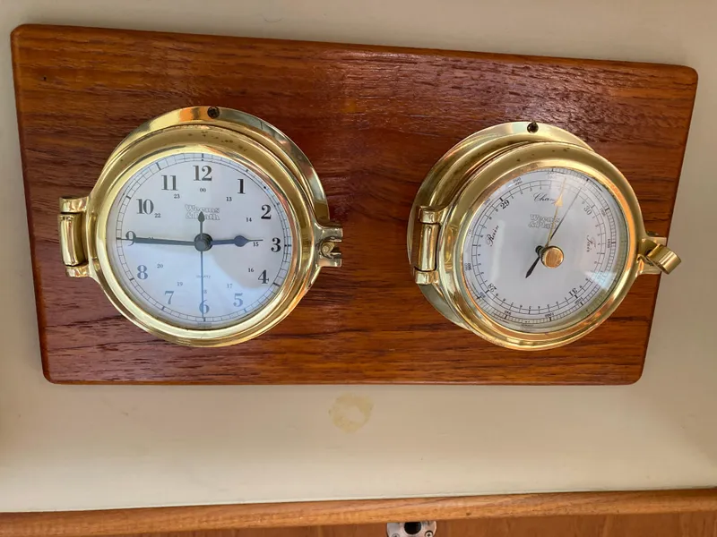 Slide: The Image of Brass clock and barometer on wooden plaque, Grand Banks 42 Classic, 1985. - 12