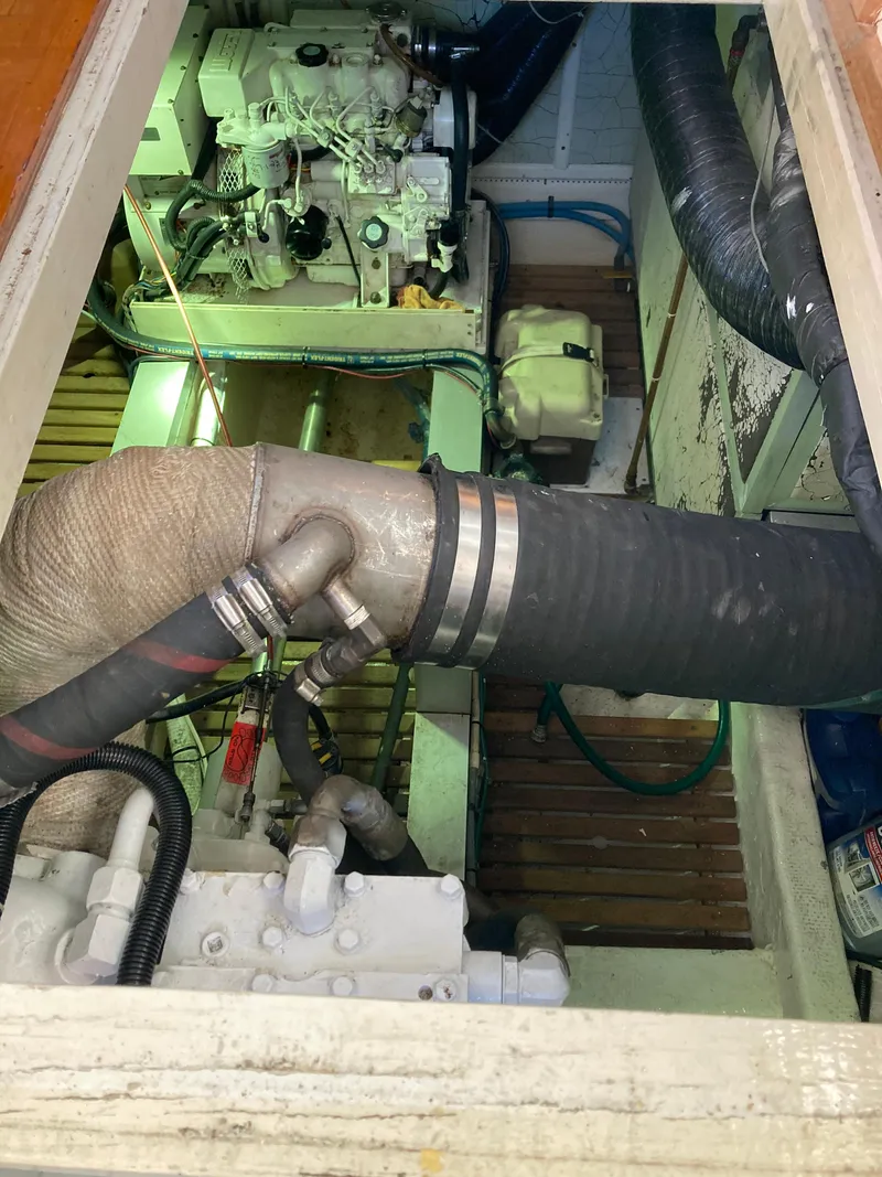 Slide: The Image of Engine room of 1985 Grand Banks 42 Classic with visible machinery and piping. - 35