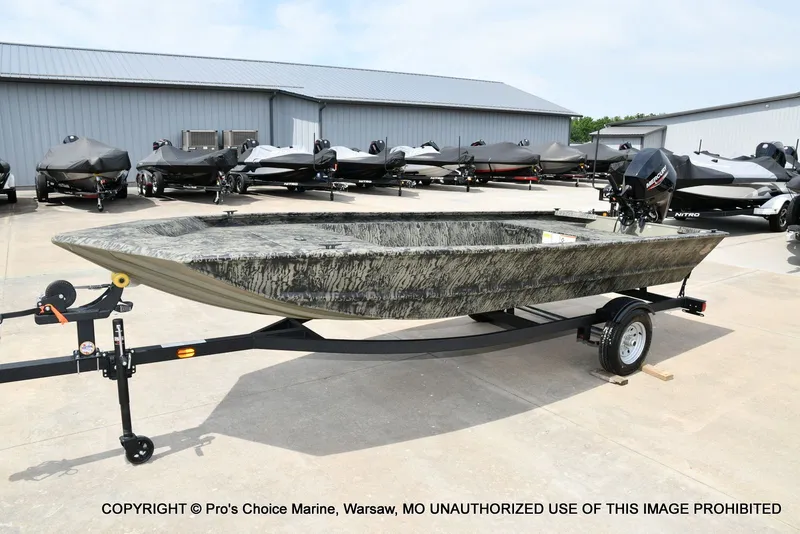 Slide: The Image of 2026 Tracker Grizzly 1648 Jon boat on trailer outdoors. - 13